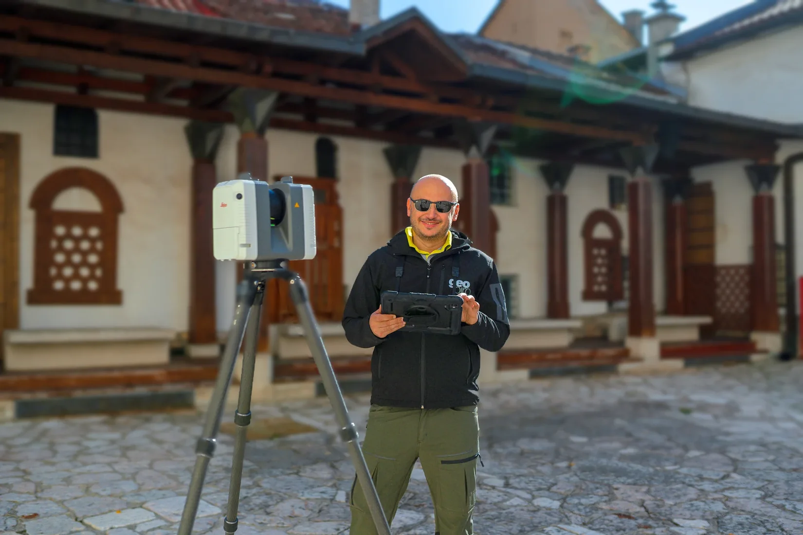 Geobiro surveyor and scanning equipment beside an existing building.