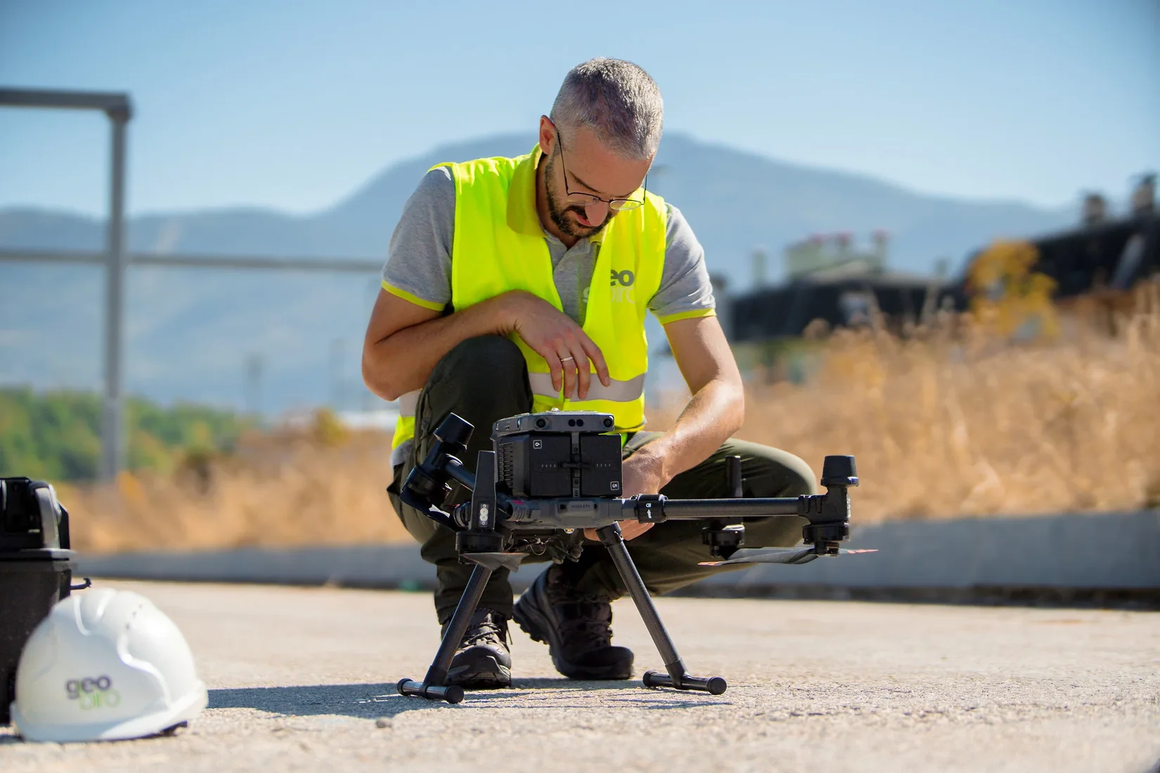 Geobiro team member preparing a survey drone for fieldwork.